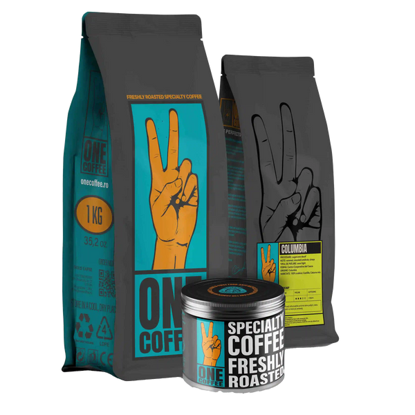 Ambalaje ONE Coffee — pungă de 1 kg, pungă cu eticheta Columbia Decaf și cutie metalică pentru cafea de specialitate proaspăt prăjită